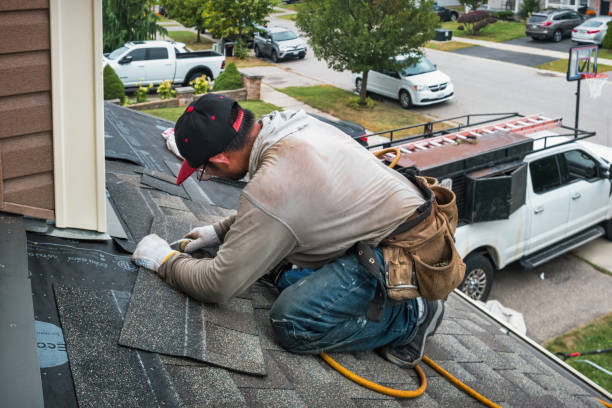 Professional Roofing technician working in Boxborough, MA